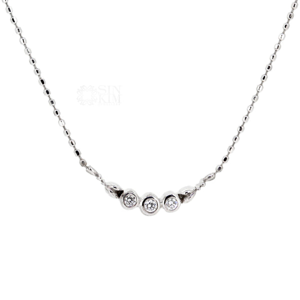 Dainty diamond trinity necklace with floral motif on 18k, 18" white gold faceted ball chain. Great for everyday wear and necklace layering. Made in Toronto, Canada