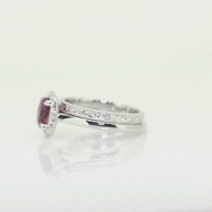 rectangle cushion cut wine coloured red sapphire set in white gold with hand engraved halo with 2mm wide hand engraved wedding band