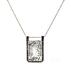 Fascinating tourmaline inclusions happen naturally in quarts crystals, creating a look of branches frozen in ice.  The Winter Lake Necklace is inspired by this icy image.  The large octagonal gem is set in 14k white gold with black diamonds channel set around it. One of a Kind.  Ethically sourced.  Made in Canada