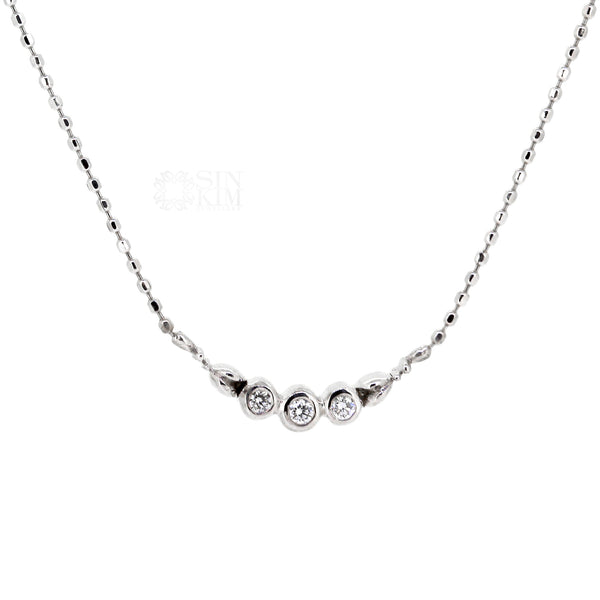 Dainty diamond trinity necklace with floral motif on 18k, 18" white gold faceted ball chain.  Great for everyday wear and necklace layering.  Made in Toronto, Canada